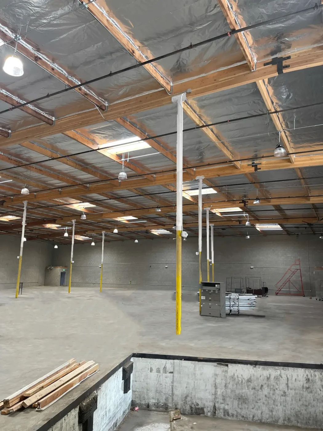 Interior construction with exposed roof structure and materials